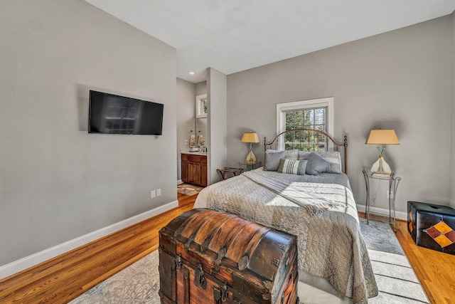 20 Waverly Ct, Moneta, VA 24121 - bedroom featuring ensuite bath, baseboards, and wood finished floors