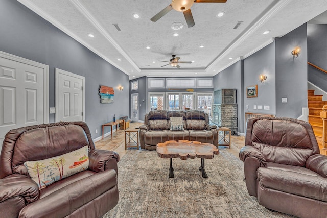 20 Waverly Ct, Moneta, VA 24121 - living room featuring visible vents, ornamental molding, stairway, a raised ceiling, and ceiling fan