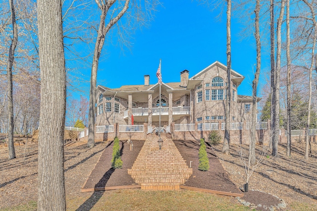 20 Waverly Ct, Moneta, VA 24121 - rear view of house with a chimney, a balcony, and fence