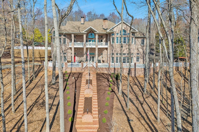 20 Waverly Ct, Moneta, VA 24121 - rear view of house with a balcony, fence, and a chimney