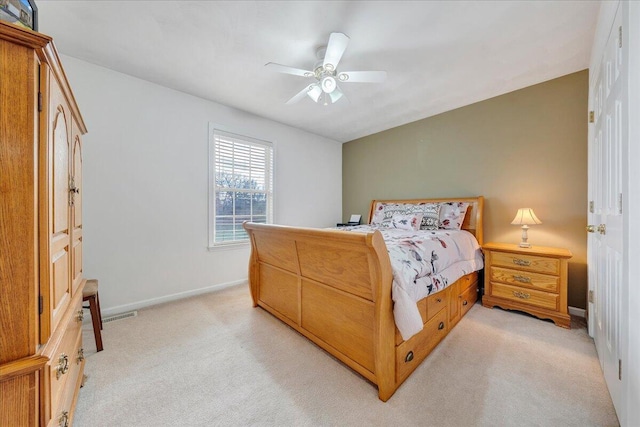 bedroom featuring baseboards, ceiling fan, and light colored carpet