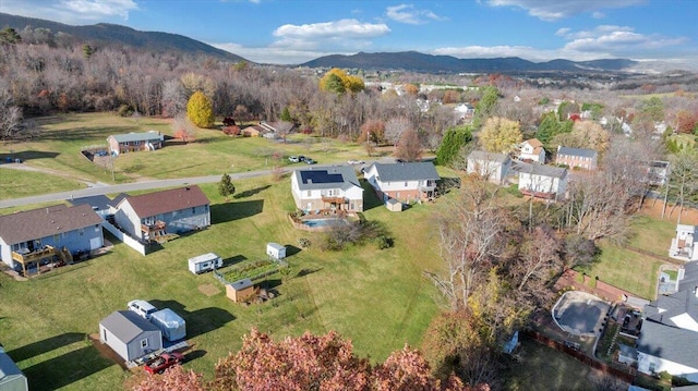 birds eye view of property with a residential view and a mountain view