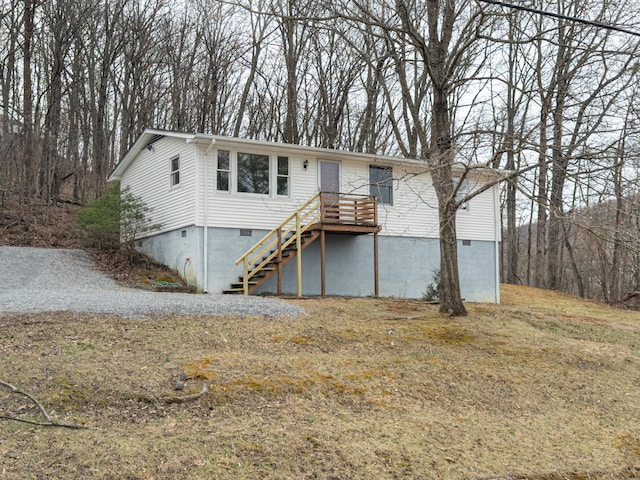 view of front of property featuring stairway