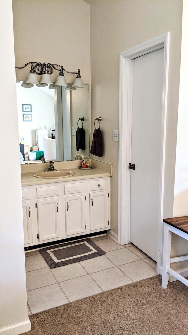 bathroom featuring tile patterned flooring and vanity