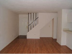 below grade area with stairway and wood finished floors