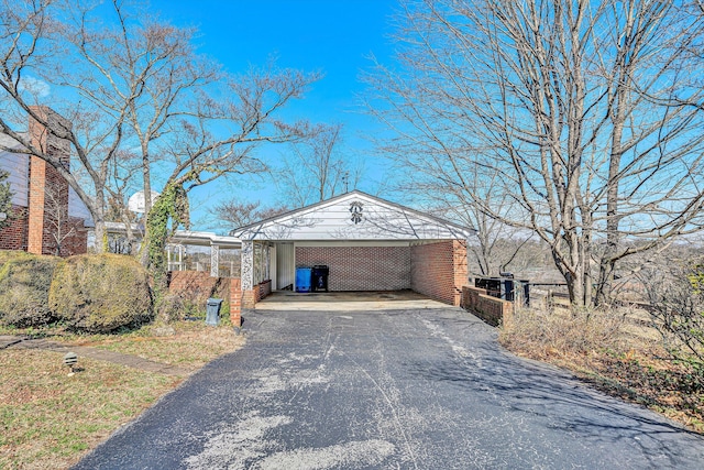 exterior space with driveway and a carport