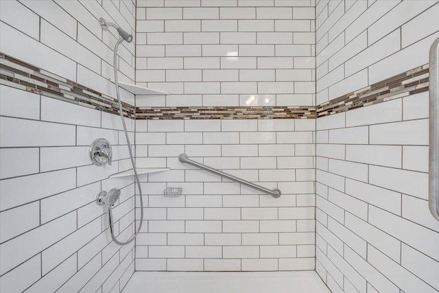 bathroom with tiled shower