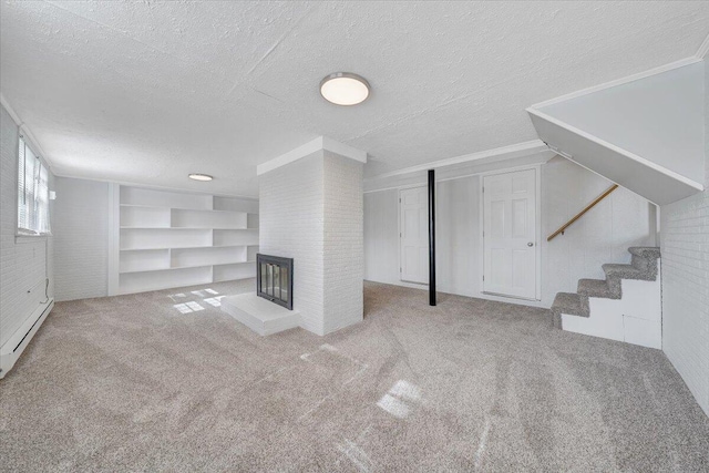 below grade area featuring a textured ceiling, a baseboard radiator, a fireplace, and carpet flooring