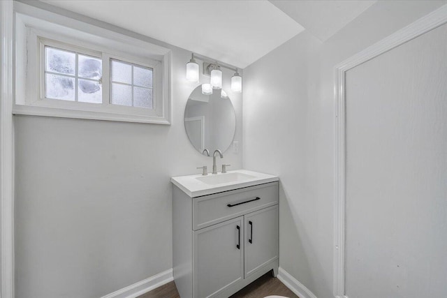 bathroom featuring vanity and baseboards