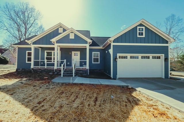 craftsman house featuring a garage, concrete driveway, a porch, and board and batten siding