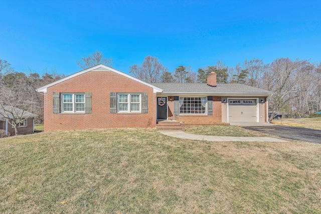 single story home featuring brick siding, a front lawn, and an attached garage