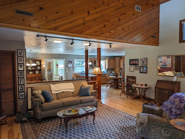 living room with visible vents and light wood-style floors