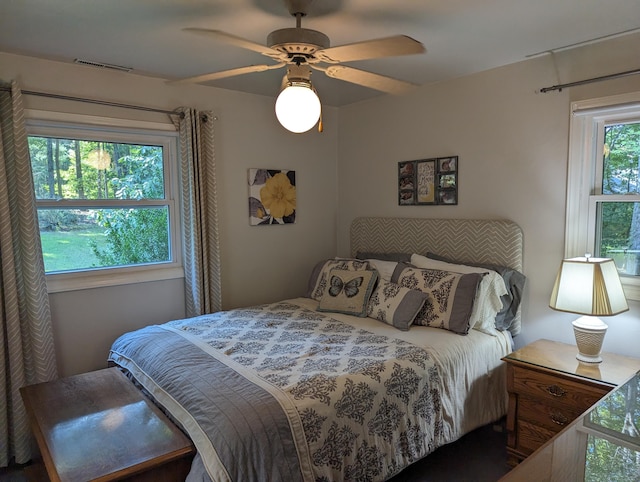 bedroom with visible vents and a ceiling fan