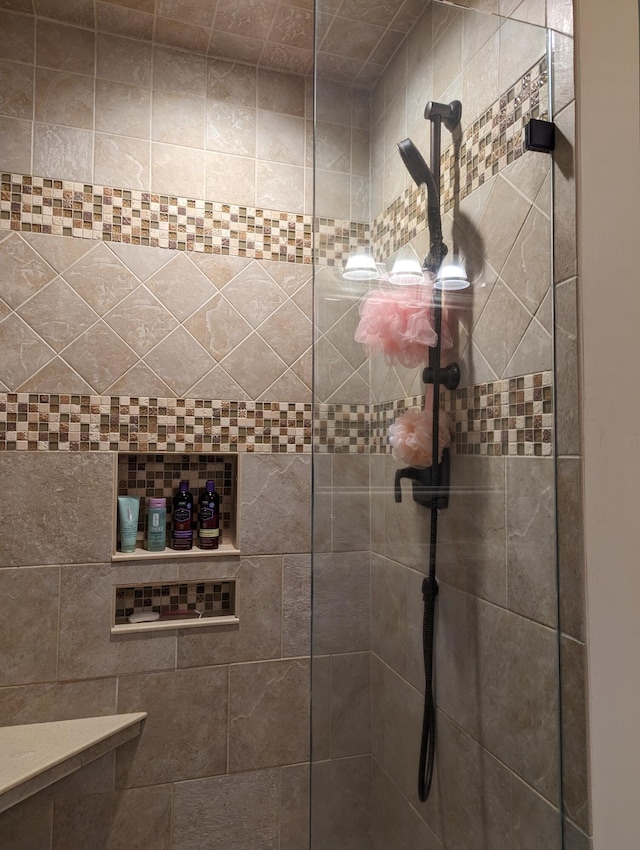 full bathroom with tiled shower