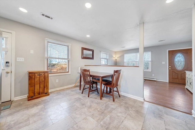 dining room with a wealth of natural light, recessed lighting, visible vents, and baseboards