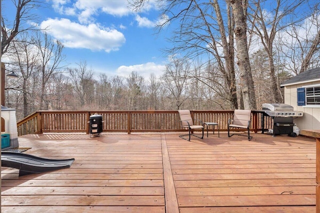 wooden deck with grilling area