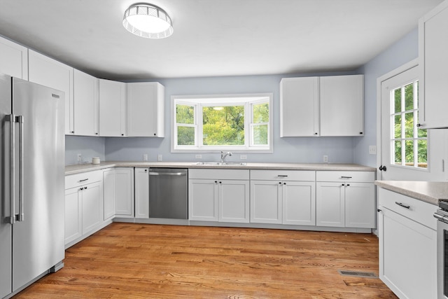 47 Westover Rd, Rocky Mount, VA 24151 - kitchen featuring visible vents, appliances with stainless steel finishes, light countertops, white cabinetry, and a sink