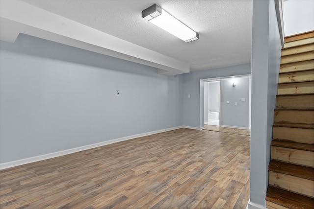 47 Westover Rd, Rocky Mount, VA 24151 - finished basement featuring wood finished floors, a textured ceiling, baseboards, and stairs