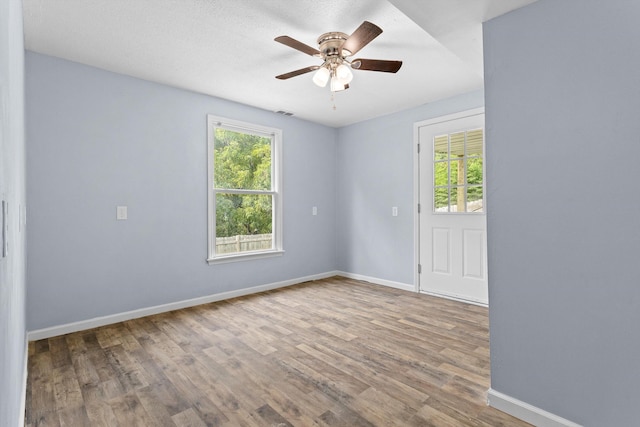 47 Westover Rd, Rocky Mount, VA 24151 - empty room with wood finished floors, a ceiling fan, and baseboards