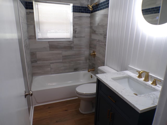 bathroom with  shower combination, vanity, wood finished floors, and toilet