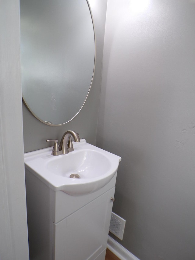 bathroom with visible vents and vanity