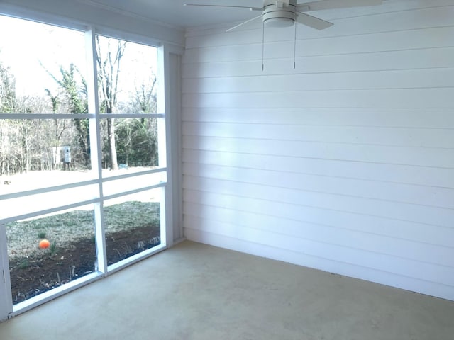 empty room with plenty of natural light and ceiling fan