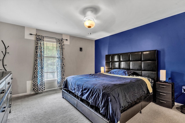 bedroom with carpet flooring and baseboards