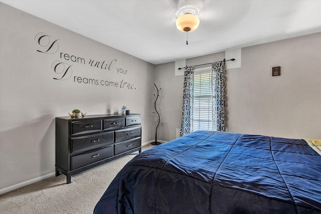 bedroom with carpet and baseboards