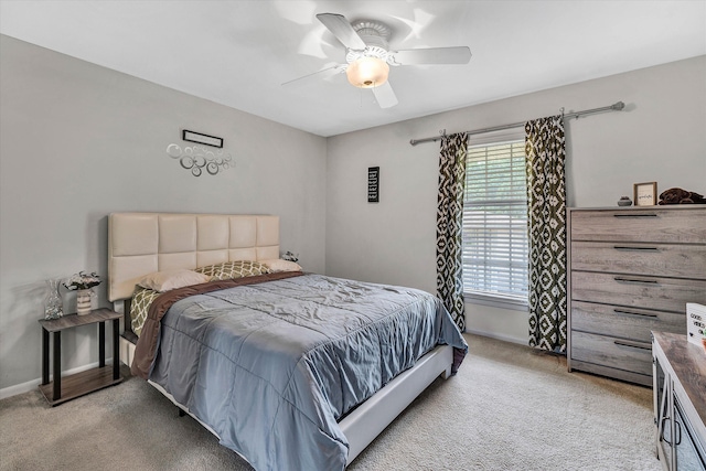 bedroom featuring carpet, ceiling fan, and baseboards