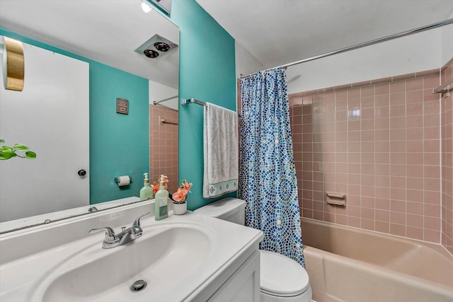 bathroom with vanity, shower / bath combo with shower curtain, and toilet