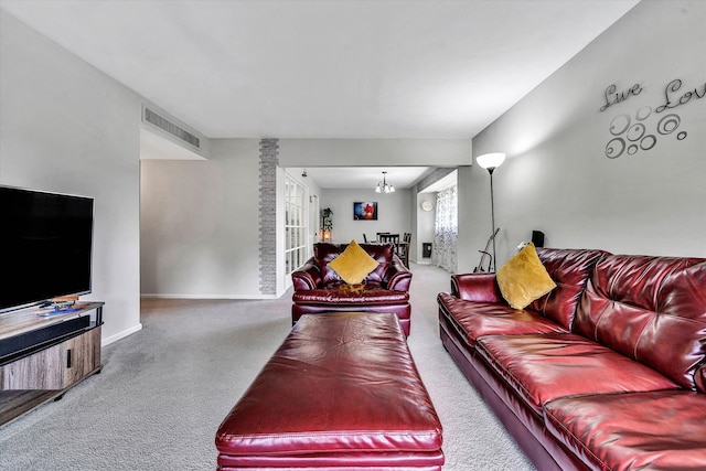 carpeted living room featuring visible vents and baseboards