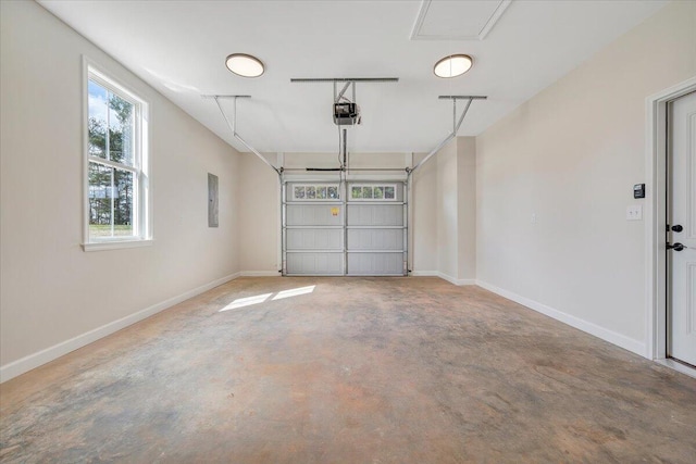 garage featuring electric panel, baseboards, and a garage door opener