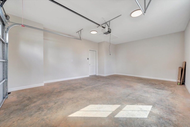 garage featuring baseboards and a garage door opener