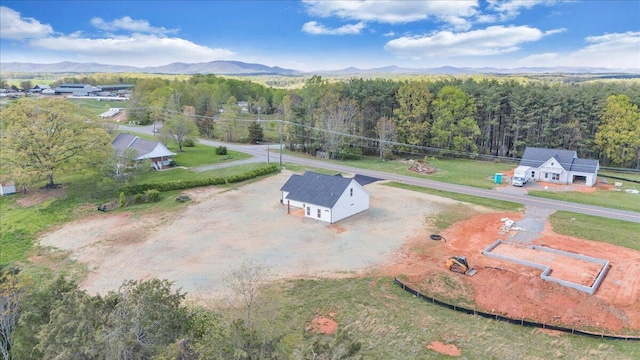 drone / aerial view with a view of trees and a mountain view