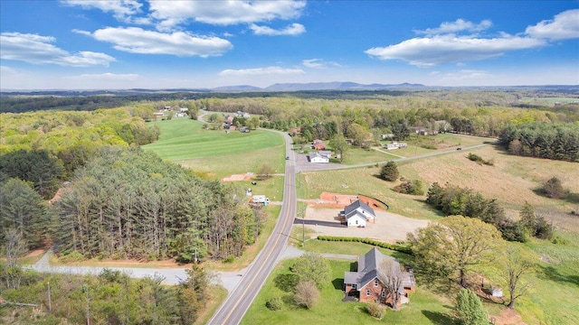 aerial view featuring a wooded view