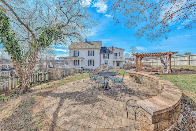 view of patio / terrace featuring a fenced backyard and a pergola