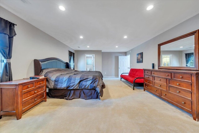 bedroom featuring recessed lighting, light colored carpet, and baseboards