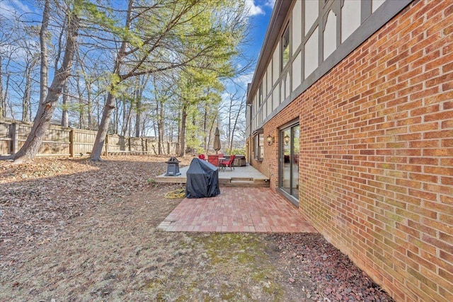 view of yard featuring a patio area and fence