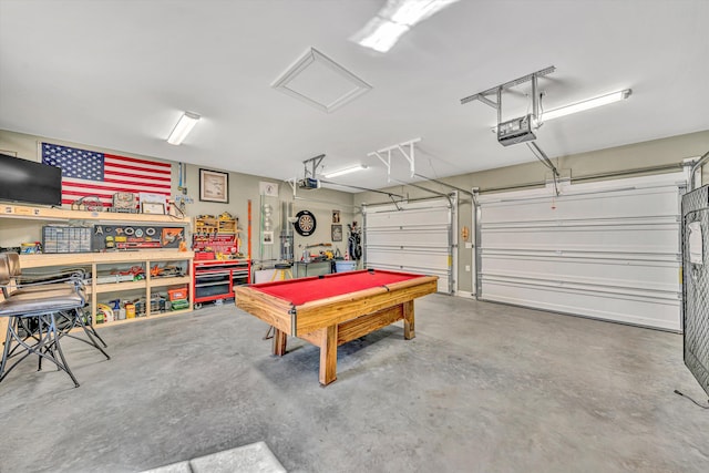 garage featuring a garage door opener and a workshop area