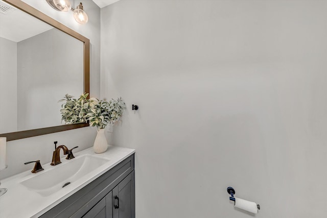 bathroom with visible vents and vanity