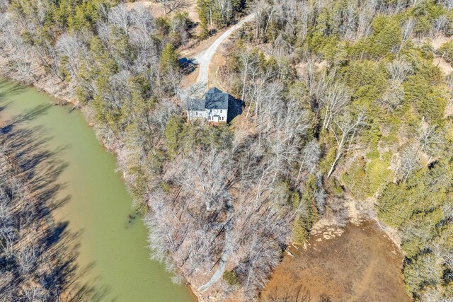 aerial view with a water view and a forest view