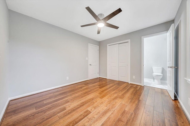 4438 Stonewall Rd NW, Roanoke, VA 24017 - unfurnished bedroom featuring light wood-style floors, a closet, baseboards, and ceiling fan