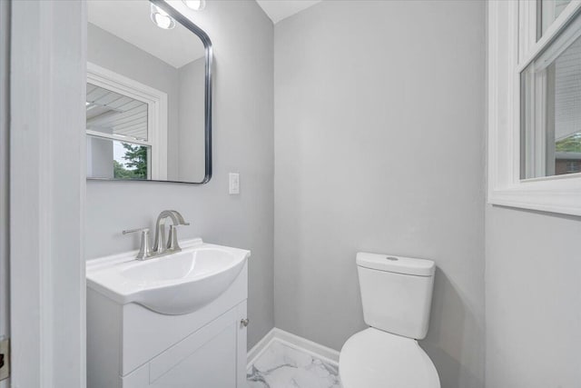 4438 Stonewall Rd NW, Roanoke, VA 24017 - bathroom with marble finish flooring, vanity, toilet, and baseboards