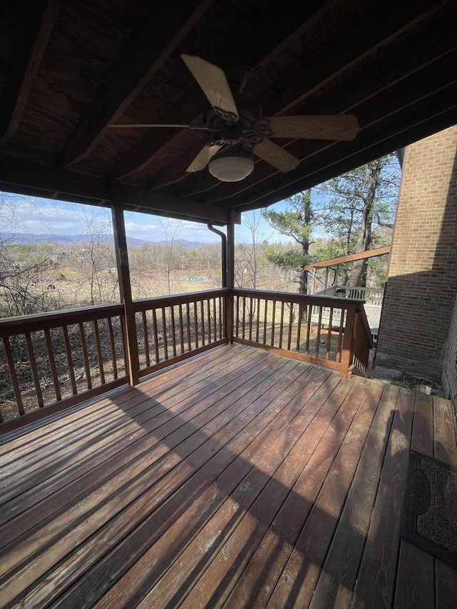 wooden deck with ceiling fan