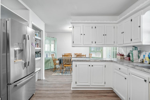 kitchen featuring open shelves, light wood finished floors, white cabinets, a peninsula, and stainless steel refrigerator with ice dispenser