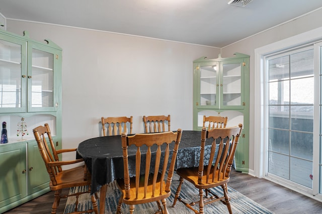 dining space featuring wood finished floors and visible vents