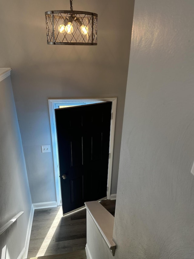 interior space featuring baseboards and wood finished floors