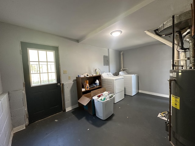 below grade area with washing machine and dryer, water heater, concrete block wall, and baseboards