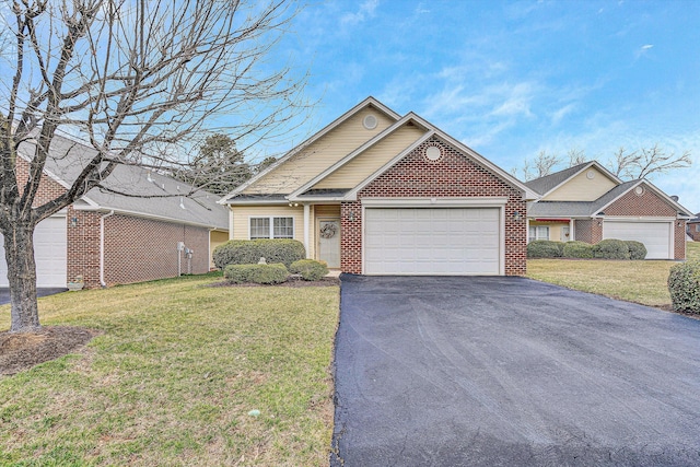 ranch-style home featuring driveway, brick siding, a front lawn, and an attached garage