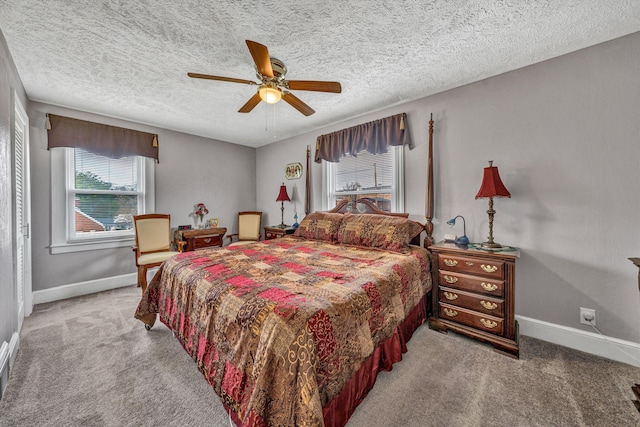 bedroom featuring light colored carpet, ceiling fan, and baseboards